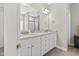 Bathroom with double sinks, granite countertops, and modern fixtures at 414 Fallingbrook Dr, Kenly, NC 27542
