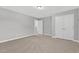 Bedroom with carpet floors, ample closet space, and neutral paint ready to be personalized at 414 Fallingbrook Dr, Kenly, NC 27542