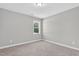 Inviting bedroom with natural light and plush carpet provides a soothing and comfortable setting at 414 Fallingbrook Dr, Kenly, NC 27542