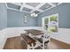 Elegant dining room features coffered ceiling, wainscoting, and natural light at 414 Fallingbrook Dr, Kenly, NC 27542