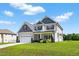 Attractive two-story house with a two-car garage and a well-kept lawn at 414 Fallingbrook Dr, Kenly, NC 27542