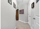 Hallway with neutral tones, carpeted floors, and decorative accents for a welcoming feel at 414 Fallingbrook Dr, Kenly, NC 27542