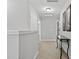 Light-filled hallway with neutral tones, carpeted floors, and decorative accents for a welcoming feel at 414 Fallingbrook Dr, Kenly, NC 27542