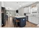 Open concept kitchen showcases a large island, stainless steel appliances, and seamless view into the living area at 414 Fallingbrook Dr, Kenly, NC 27542