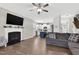 Bright living room adjacent to the modern kitchen features a fireplace and ample space for relaxing and entertaining at 414 Fallingbrook Dr, Kenly, NC 27542