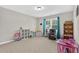 Playroom with large windows, natural light and neutral paint at 414 Fallingbrook Dr, Kenly, NC 27542