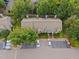 An overhead view of the townhouse complex featuring manicured lawns and adjacent parking at 4406 Still Pines Dr, Raleigh, NC 27613