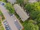 Aerial shot highlighting a townhouse complex surrounded by verdant landscaping and convenient parking at 4406 Still Pines Dr, Raleigh, NC 27613