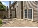 Image of the back exterior with a concrete patio, showing doors leading into the home at 4406 Still Pines Dr, Raleigh, NC 27613
