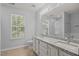 Bathroom featuring double sinks, granite countertop and bright natural light at 4406 Still Pines Dr, Raleigh, NC 27613