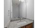 Bathroom features granite countertop, wood cabinetry, white porcelain sink, and chrome fixtures at 4406 Still Pines Dr, Raleigh, NC 27613