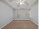 Bedroom with ceiling fan and windows at 4406 Still Pines Dr, Raleigh, NC 27613