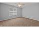 Bright bedroom with a ceiling fan and a large window allowing for ample natural light at 4406 Still Pines Dr, Raleigh, NC 27613