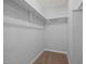 Small walk-in closet with carpet and shelving at 4406 Still Pines Dr, Raleigh, NC 27613