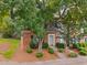 Inviting townhome featuring a well-maintained lawn, brick facade, and convenient parking in front at 4406 Still Pines Dr, Raleigh, NC 27613