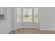 Bright living room featuring a bay window that allows ample natural light to fill the space at 4406 Still Pines Dr, Raleigh, NC 27613