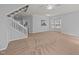 Large living room that flows to the kitchen and a bay window, complete with a staircase at 4406 Still Pines Dr, Raleigh, NC 27613