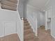 Carpeted staircase with white railing leading to the upper level of the home at 4406 Still Pines Dr, Raleigh, NC 27613