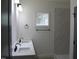 Bathroom featuring double vanity with white quartz countertops and a walk-in shower at 4511 Denfield St, Durham, NC 27704