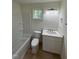 Clean bathroom featuring tub, toilet, and sink with light countertop at 4511 Denfield St, Durham, NC 27704