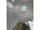 Bathroom with tiled shower and tub combination, offering a clean and modern design at 4511 Denfield St, Durham, NC 27704