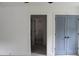 Spacious bedroom with double doors leading to a bathroom, offering privacy and style at 4511 Denfield St, Durham, NC 27704