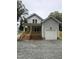Charming two-story home featuring a welcoming front porch and a convenient attached garage at 4511 Denfield St, Durham, NC 27704