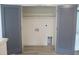 Dedicated laundry closet with utility connections and space for laundry appliances, hidden behind double doors at 4511 Denfield St, Durham, NC 27704