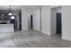 Open concept living space with modern flooring, neutral walls and a view of the kitchen at 4511 Denfield St, Durham, NC 27704