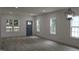 Bright and airy living room with stylish floors, neutral walls and lots of natural light at 4511 Denfield St, Durham, NC 27704