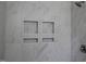 New shower with marble-look tiles and built-in shelving, offering a luxurious and convenient showering experience at 4511 Denfield St, Durham, NC 27704