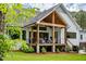 Inviting back porch featuring a covered area with comfortable seating, perfect for relaxing and enjoying the outdoors at 46 Lakes Edge Ln, Pittsboro, NC 27312