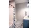 Modern bathroom with updated vanity, patterned tile floors, and a whimsical shower curtain at 46 Lakes Edge Ln, Pittsboro, NC 27312