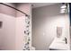 Stylish bathroom with patterned tile, updated vanity, and a charming dinosaur-themed shower curtain at 46 Lakes Edge Ln, Pittsboro, NC 27312