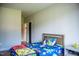 Cozy bedroom with inviting Mario-themed bedding and ample natural light at 46 Lakes Edge Ln, Pittsboro, NC 27312