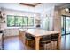 Gourmet kitchen with large island, bar seating, stainless appliances, and natural light from a large window at 46 Lakes Edge Ln, Pittsboro, NC 27312
