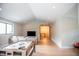 Spacious living room with vaulted ceilings, hardwood floors, and large windows for ample natural light at 46 Lakes Edge Ln, Pittsboro, NC 27312