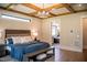Comfortable main bedroom features a decorative ceiling and adjoins the main bath at 46 Lakes Edge Ln, Pittsboro, NC 27312