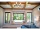 Bright main bedroom with a window seat overlooking a well maintained backyard at 46 Lakes Edge Ln, Pittsboro, NC 27312