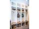 Functional mudroom with custom lockers, bench seating, storage baskets, and convenient hanging hooks at 46 Lakes Edge Ln, Pittsboro, NC 27312