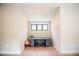Cozy office nook with built-in desk, storage cabinets, and a window for natural light at 46 Lakes Edge Ln, Pittsboro, NC 27312