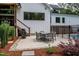 Cozy outdoor patio with a dining set and grill, perfect for entertaining and enjoying the backyard ambiance at 46 Lakes Edge Ln, Pittsboro, NC 27312