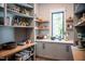 Spacious pantry featuring custom shelves, cabinetry, stylish backsplash, counter space, and a bright window at 46 Lakes Edge Ln, Pittsboro, NC 27312