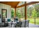 Enjoy the view from this lovely porch, complete with comfortable seating and an overhead view of the pool at 46 Lakes Edge Ln, Pittsboro, NC 27312