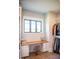 Well-organized walk-in closet with a custom vanity and natural light from the window at 46 Lakes Edge Ln, Pittsboro, NC 27312