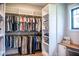 Custom walk-in closet with a built-in desk and window for natural light at 46 Lakes Edge Ln, Pittsboro, NC 27312