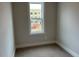 A simple bedroom with carpet and a window viewing equipment in the construction zone at 502 Yeowell Dr, Chapel Hill, NC 27514