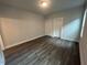 Spacious bedroom with wood flooring and two closets, offering ample storage space at 502 Yeowell Dr, Chapel Hill, NC 27514