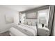 Bright bedroom featuring a large bed with soft bedding and stylish lamps on bedside tables at 502 Yeowell Dr, Chapel Hill, NC 27514