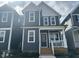 Charming two-story home with a covered front porch and well-maintained landscaping at 502 Yeowell Dr, Chapel Hill, NC 27514